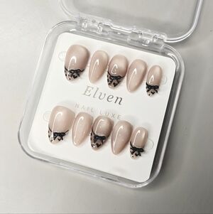 Elegant Nude Handmade Press-On Nails Short Almond with Black Bow Design